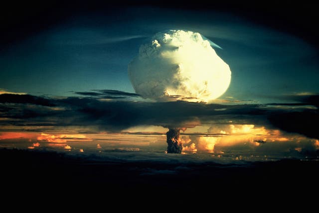 Operation Ivy Hydrogen Bomb Test in Marshall Islands A billowing white mushroom cloud, mottled with orange, pushes through a layer of clouds during Operation Ivy, <a href=