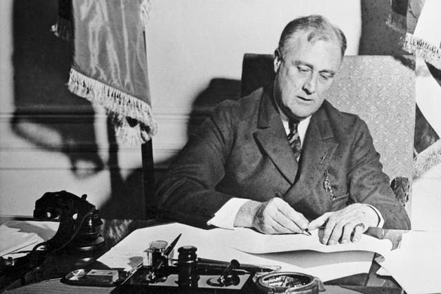 Franklin Roosevelt Signing the Emergency Banking Act.