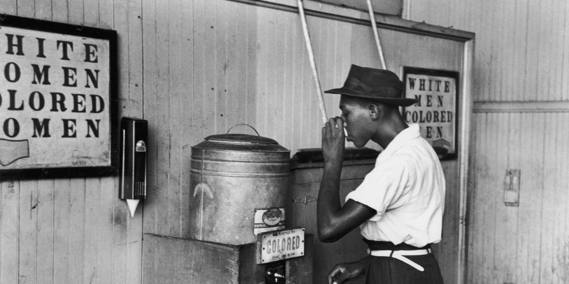 Segregated FountainJuly 1939: An African-American man drinking at a segregated drinking fountain in Oklahoma City, Oklahoma. (Photo by Russell Lee/Library Of Congress/Getty Images)