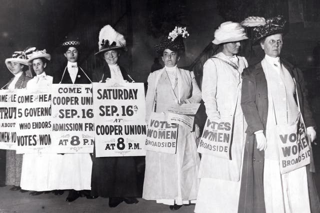 Suffragettes Marching with Signs(Original Caption) New York: New York Society Woman Suffragettes as sandwich men advertise a mass meeting to be addressed by the Governor of the Suffrage states. Photograph.
