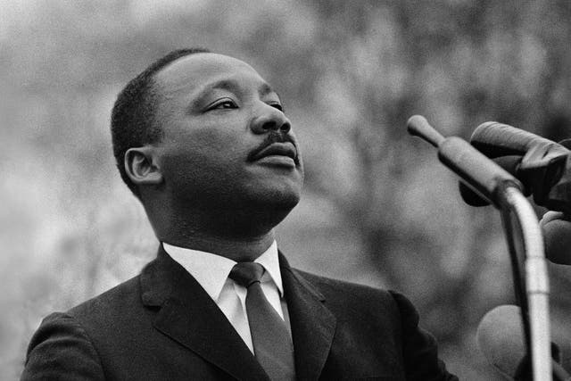 Dr. Martin Luther King, Jr. speaking before crowd of 25,000 civil rights marchers in front of the Montgomery, Alabama state capital building on March 25, 1965.