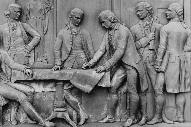 The signing of the Treaty of Paris, a peace treaty between the United States and Great Britain which concluded the American War of Independence, immortalized in bronze on a door. (Photo by Three Lions/Getty Images)