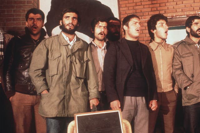 The Iranian students, who have occupied the U.S EmTEHRAN, IRAN - NOVEMBER 19: The Iranian students, who have occupied the U.S Embassy in Tehran, are singing during the second released group of U.S. Embassy staffers hold a press conference 19 November 1979, two days after Ayatollah Khomeini ordered the release of all women and black U.S. hostages. Fanatical followers of the Ayatollah Khomeini stormed the United States Embassy, 04 November 1979 in Tehran, occupied the building and took nearly 100 embassy staff and Marines hostages. (Photo credit should read H. KOTILAINEN/AFP via Getty Images)