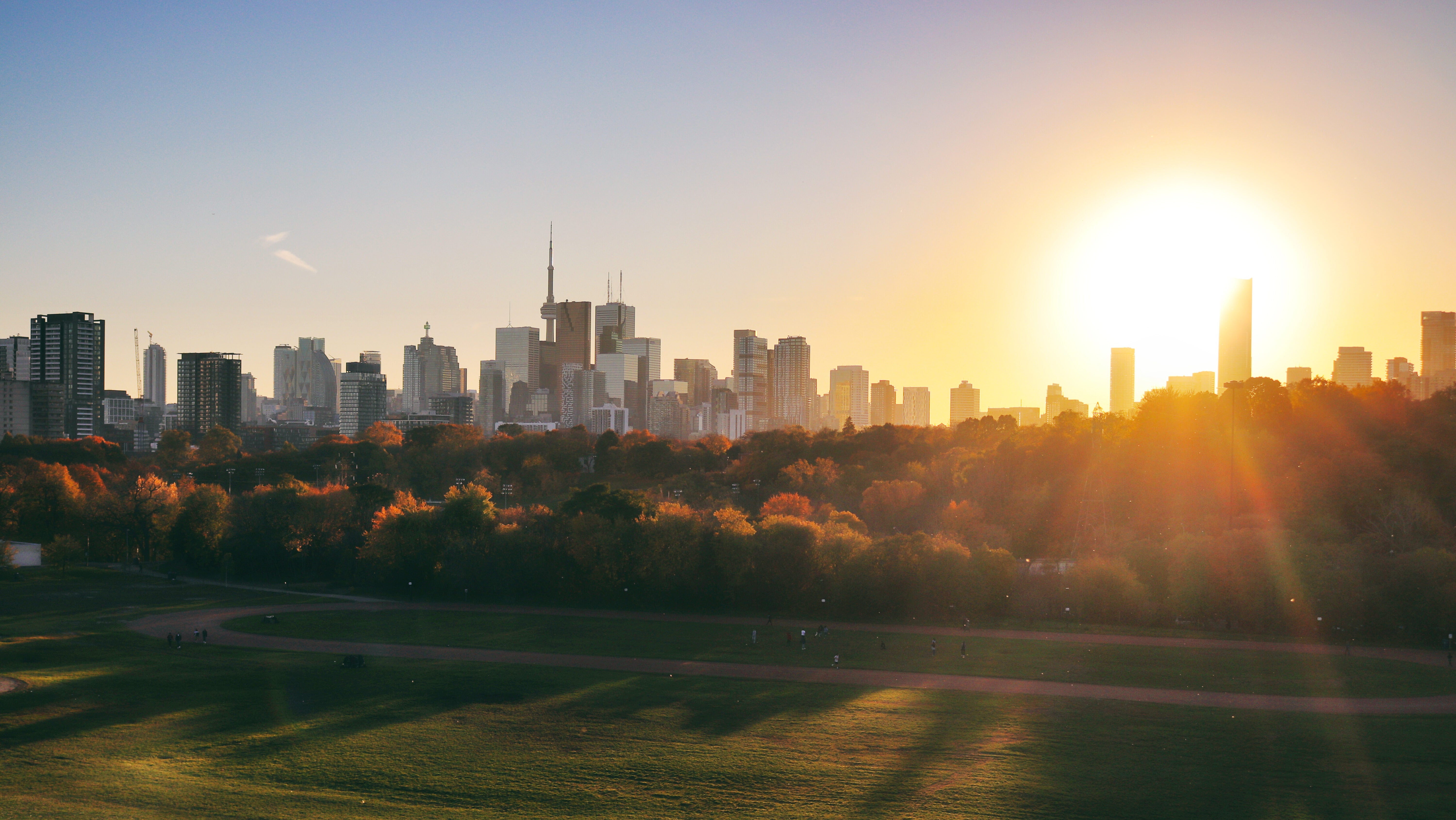 Gorgeous sunset in Toronto on a lovely day in November. The characteristic Toronto skyline with the famous CN tower grace the horizon. As seen from Riverdale Park East, Broadview.