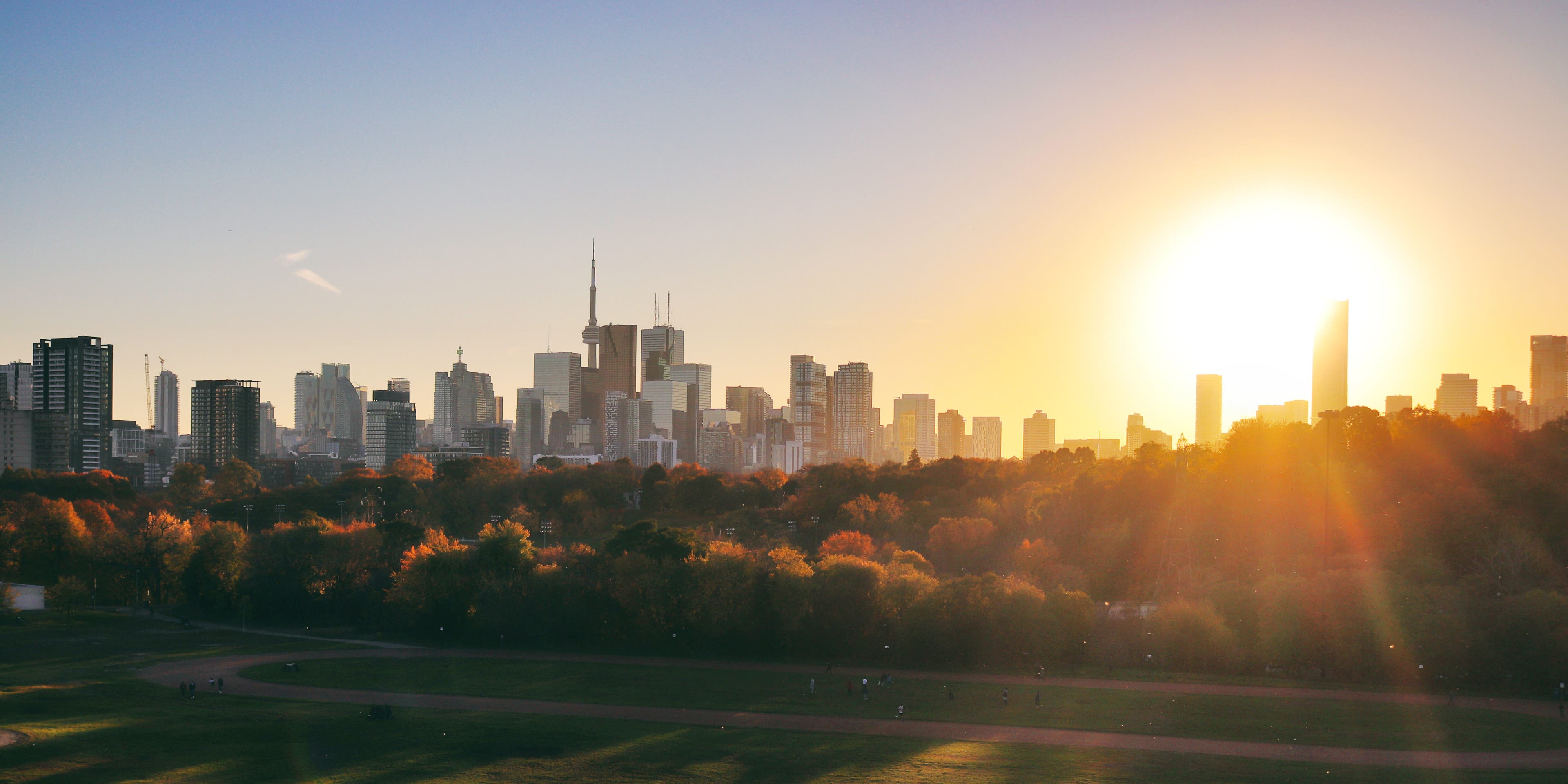 Gorgeous sunset in Toronto on a lovely day in November. The characteristic Toronto skyline with the famous CN tower grace the horizon. As seen from Riverdale Park East, Broadview.