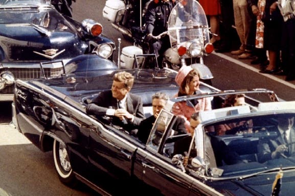 John and Jacqueline Kennedy ride through Dallas, Texas, on November 22, 1963.