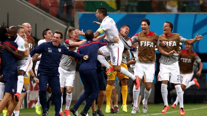 Clint Dempsey and teammates celebrate Dempsey's goal in a group match tie between the United States and Portugal at the 2014 FIFA World Cup Brazil.