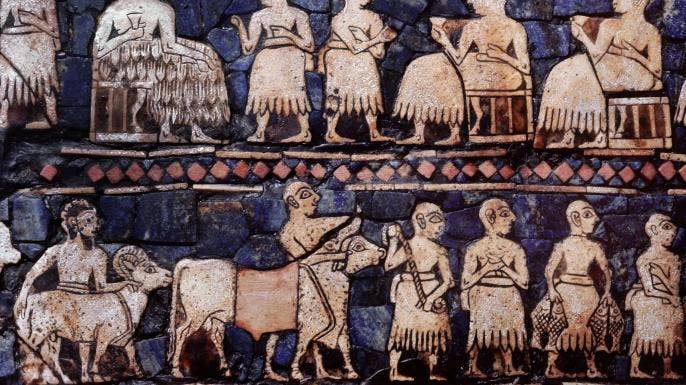 A detail from the so called Standard of Ur, side B. This panel shows a banquet, perhaps after a victory and men driving cattle and sheep.