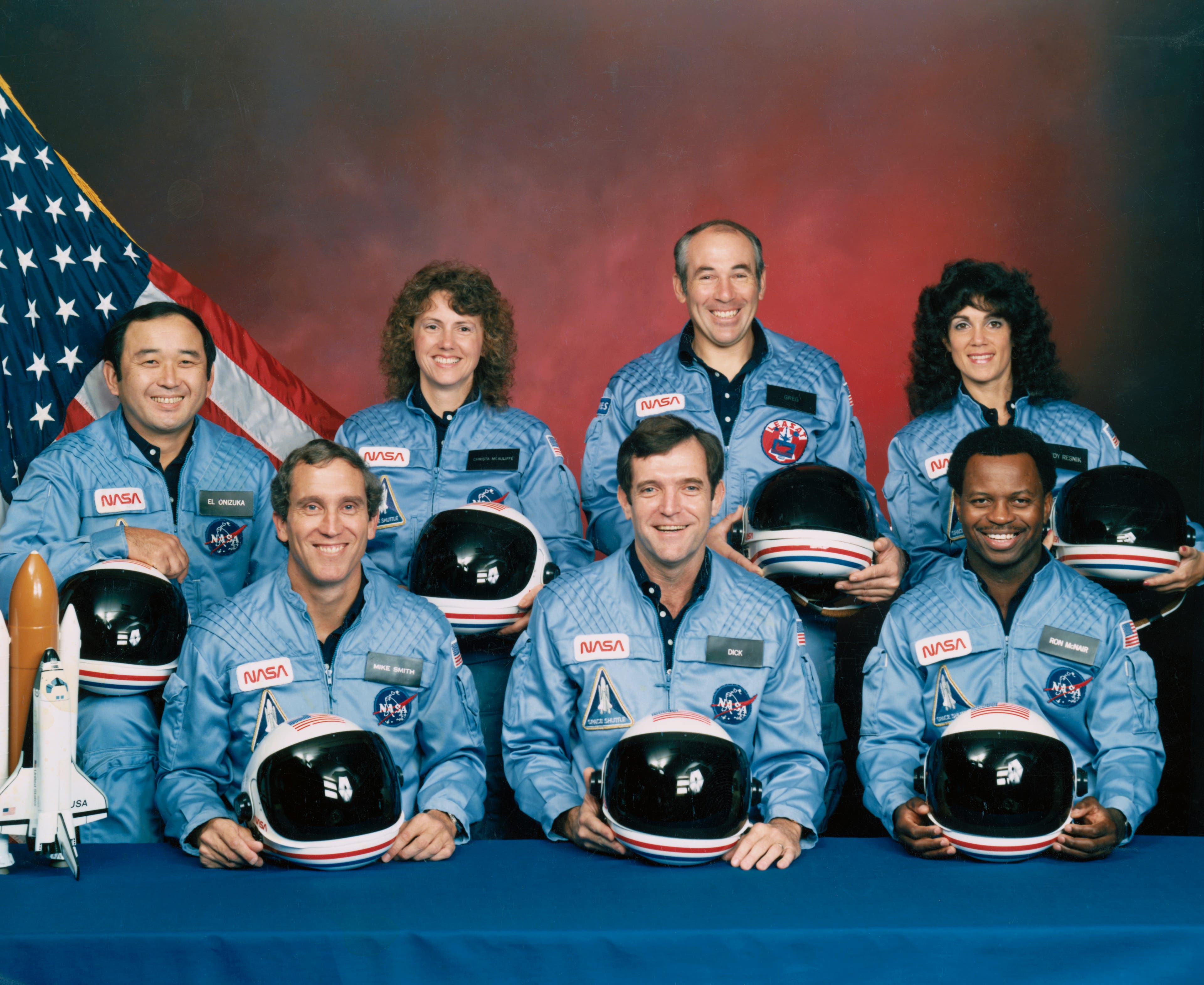 Five astronauts and two payload specialists make up the STS 51-L crew, scheduled to fly aboard the Space Shuttle Challenger in January of 1986. Crewmembers are (left to right, front row) astronauts Michael J. Smith, Francis R. (Dick) Scobee and Ronald E. McNair; and Ellison S. Onizuka, Sharon Christa McAuliffe, Gregory Jarvis and Judith A. Resnik. McAuliffe and Jarvis are payload specialists, representing the Teacher in Space Project and Hughes Co., respectively.