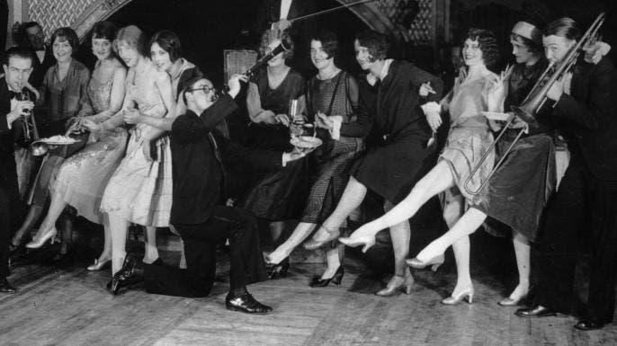 Flappers dancing while musicians perform during a Charleston dance contest at the Parody Club, New York City, 1926.