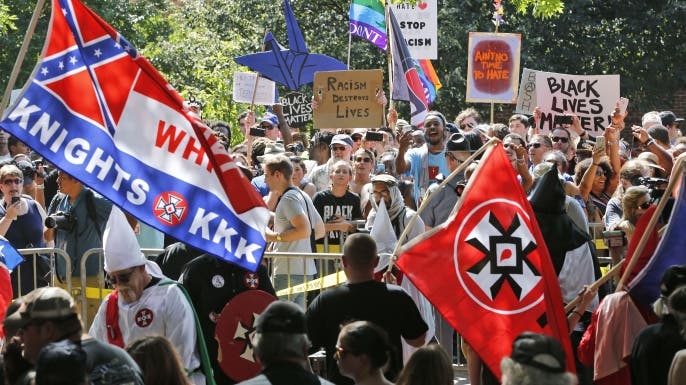A large group of protesters demonstrate against a KKK rally in Justice Park, in Charlottesville, Virginia, 2017. (Credit: AP/REX/Shutterstock)