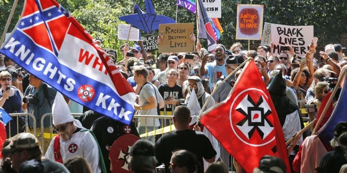 A large group of protesters demonstrate against a KKK rally in Justice Park, in Charlottesville, Virginia, 2017. (Credit: AP/REX/Shutterstock)