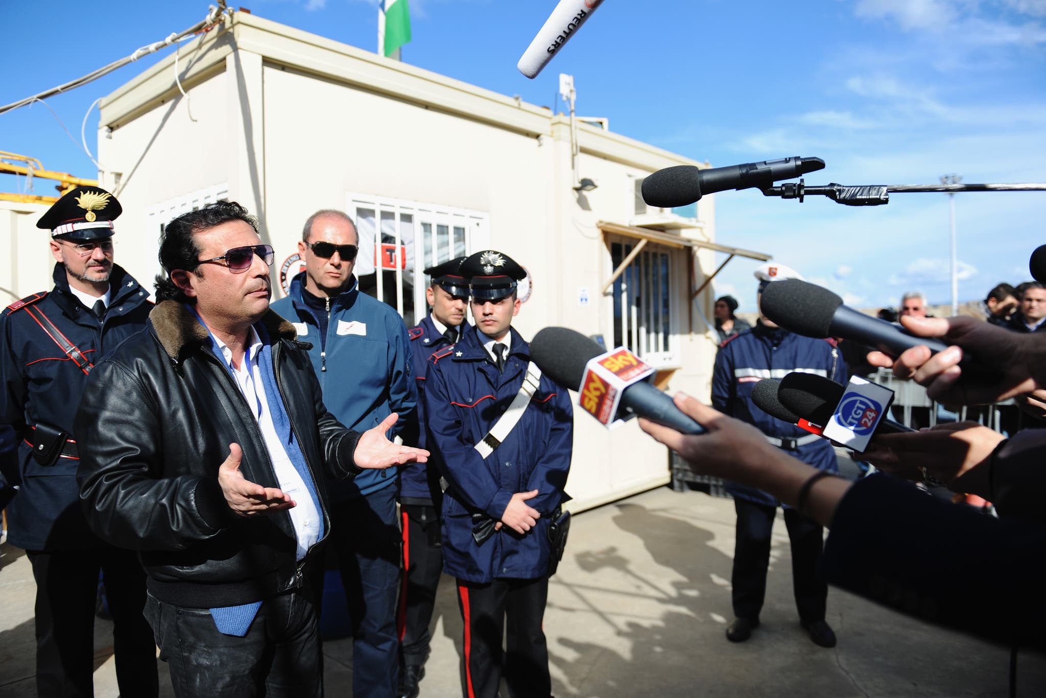 Former Captain of the Costa Concordia Francesco Schettino speaks with reporters after being aboard the ship with the team of experts inspecting the wreck on February 27, 2014 in Isola del Giglio, Italy. The Italian captain went back onboard the wreck for the first time since the sinking of the cruise ship on January 13, 2012, as part of his trial for manslaughter and abandoning ship.