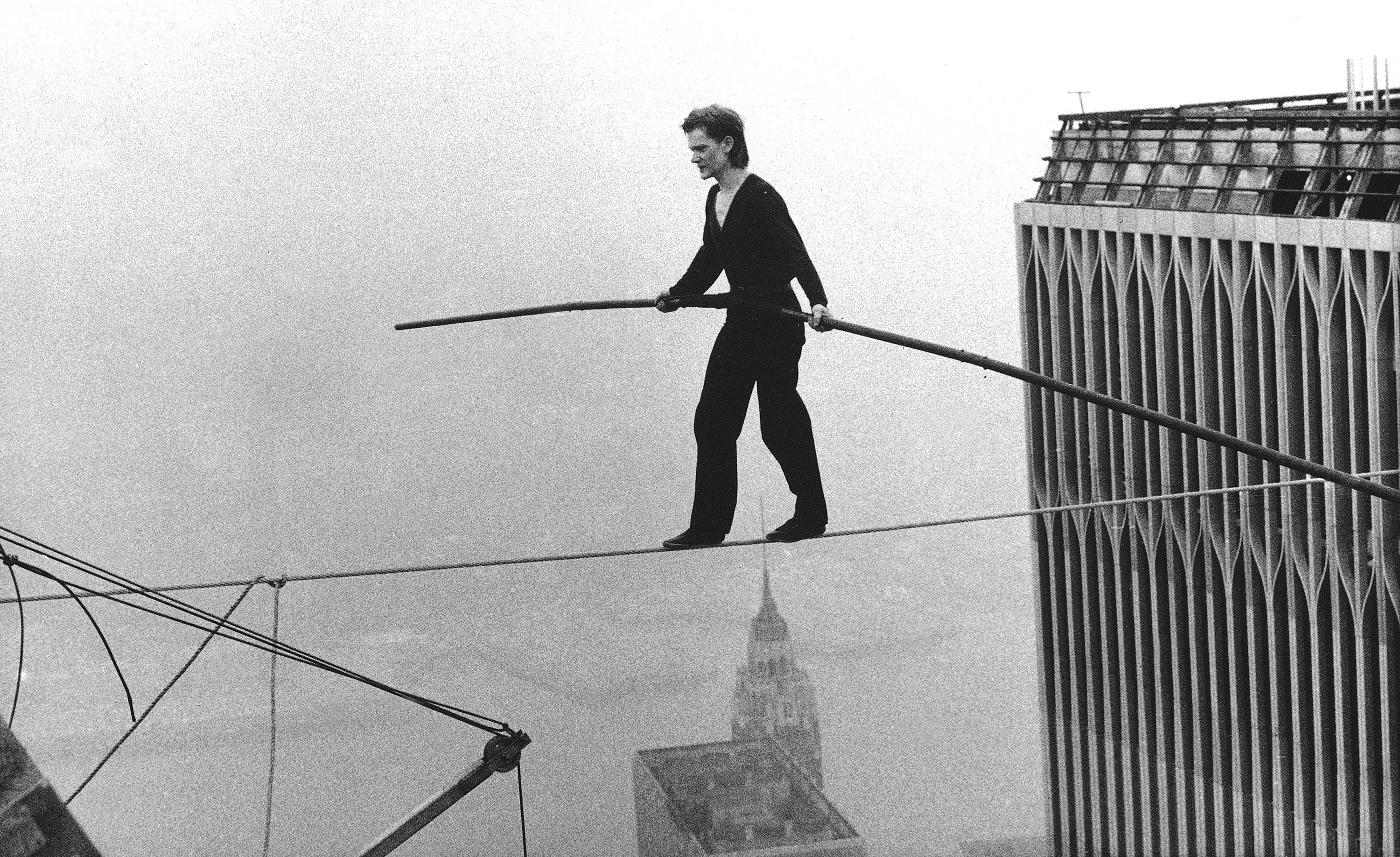 Philippe Petit crossing the Twin Towers on a tightrope.