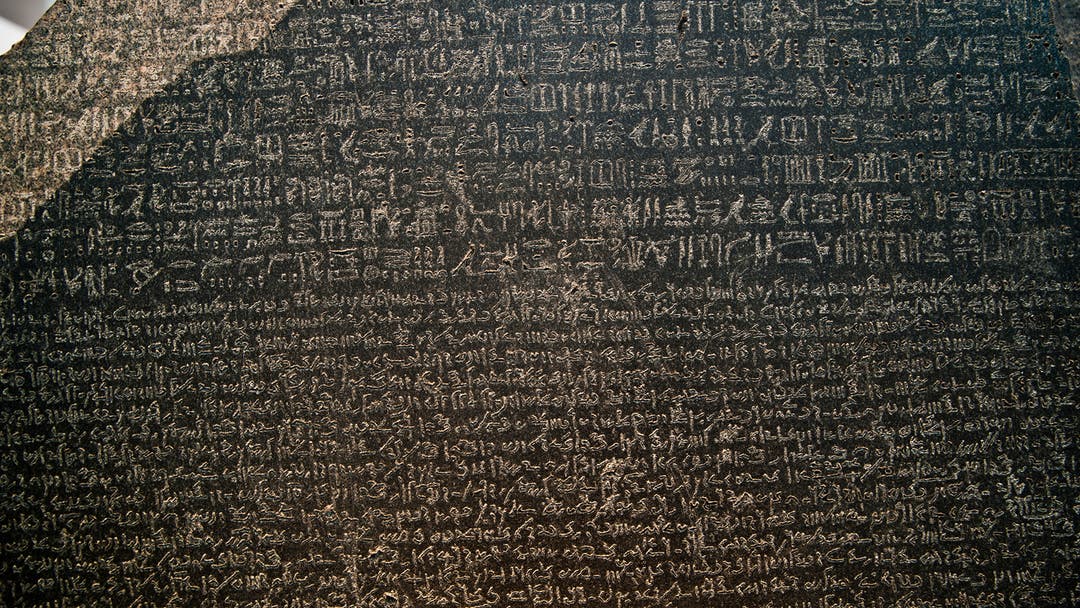 The Rosetta Stone is an ancient Egyptian granodiorite stele inscribed with a decree issued at Memphis in 196 BC on behalf of King Ptolemy V. The decree appears in three scripts: the upper text is Ancient Egyptian hieroglyphs, the middle portion Demotic script, and the lowest Ancient Greek.