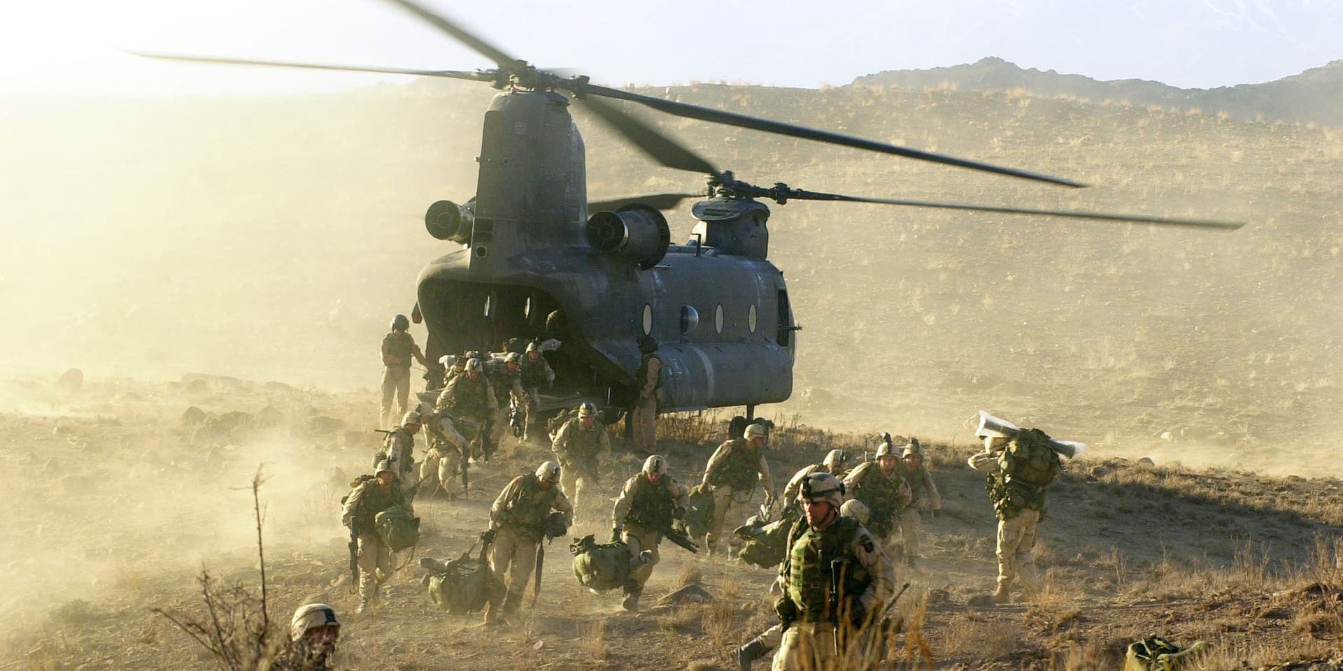 U.S. Army soldiers from the 101st Airborne division off load during a combat mission from a Chinook 47 helicopter March 5, 2002 in Eastern Afghanistan. The soldiers were participating in the largest American offensive since the beginning of the war in Afghanistan.