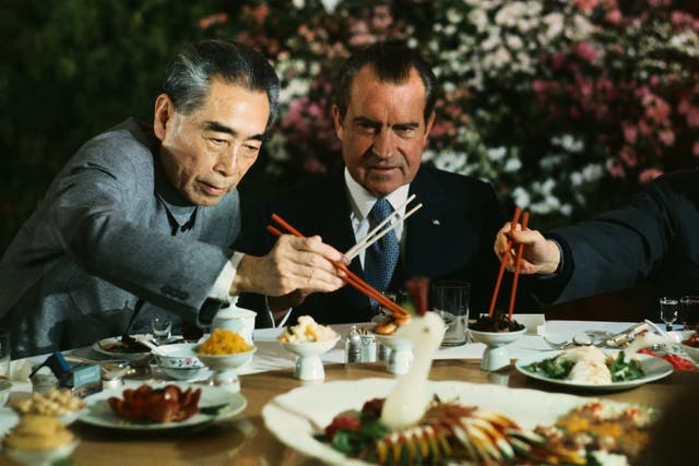 President Richard Nixon shares a meal with Premier Chou En-lai (left) and Shanghai Communist Party leader Chang Chun-chiao on February 27, 1972.
