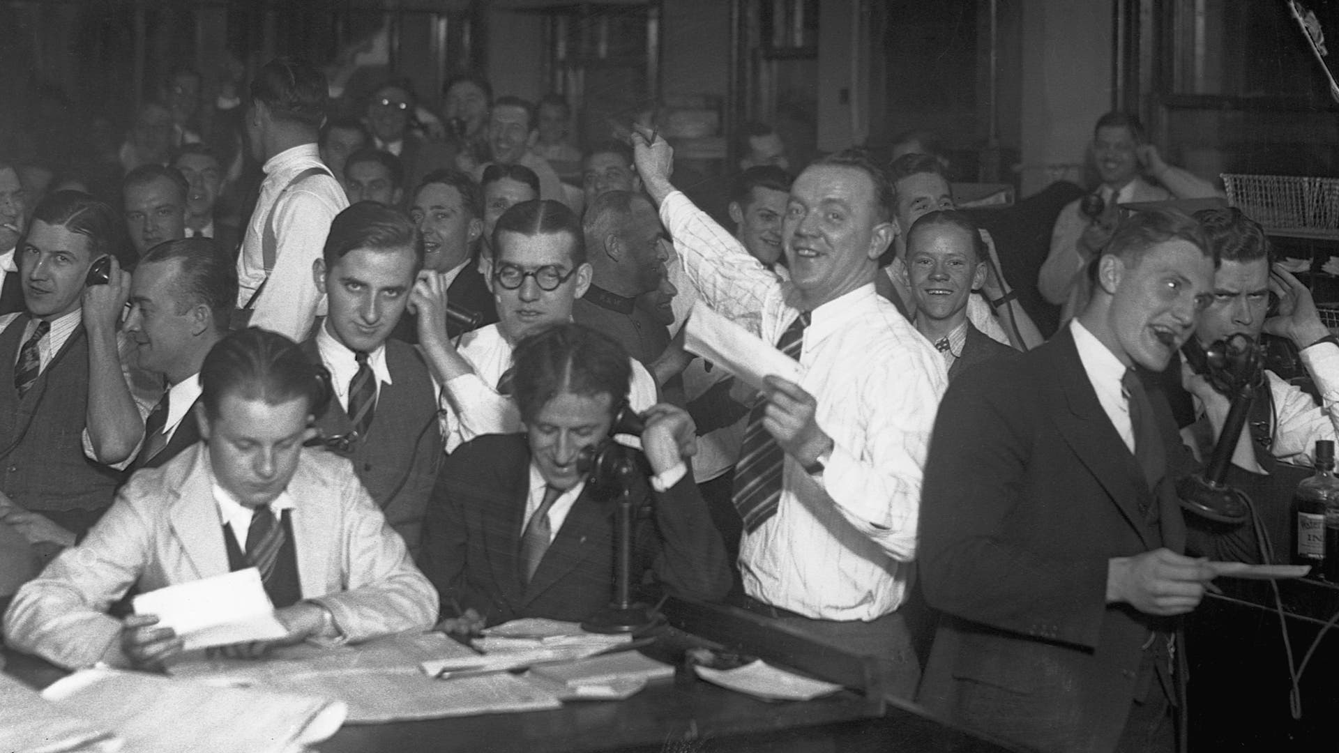 Wall Street clerks working long hours computing gains and losses, c. 1929.