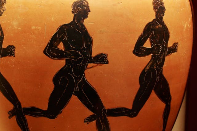 Ancient Greek Sports. Three nude athletes are depicted competing in a foot-race on an ancient Greek amphora. (Photo by: Universal History Archive/Universal Images Group via Getty Images)