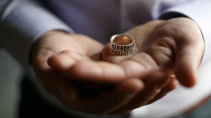 Jim Obergefell was married to his husband John Arthur on a medical jet in Maryland shortly before Arthur died of ALS. Obergefell holds his wedding band that has been fused together with Arthur's ashes and wedding ring. (Credit: Maddie McGarvey/For The Washington Post via Getty Images)