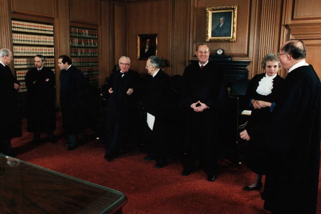 November 1991: Chief Justice of the U.S. Supreme Court William Rehnquist and the newly installed Associate Justice Clarence Thomas (l) in the Supreme Court building. All nine Supreme Court Justices are shown.