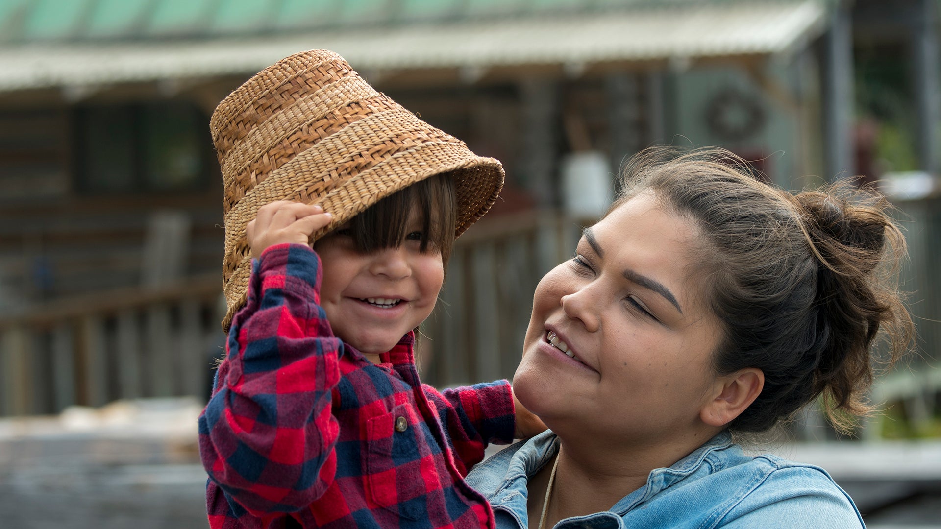 Portrait of a Tlingit mother with her boy in the village of Kake, a Tlingit village located on Kupreanof Island, Tongass National Forest, Alaska.