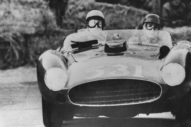 Alfonso de Portago, the Marquis of Portago (1928 - 1957) and his co-driver Edmund Nelson in their Ferrari at Peschiera in Italy during the Italian Mille Miglia road race, 12th May 1957.